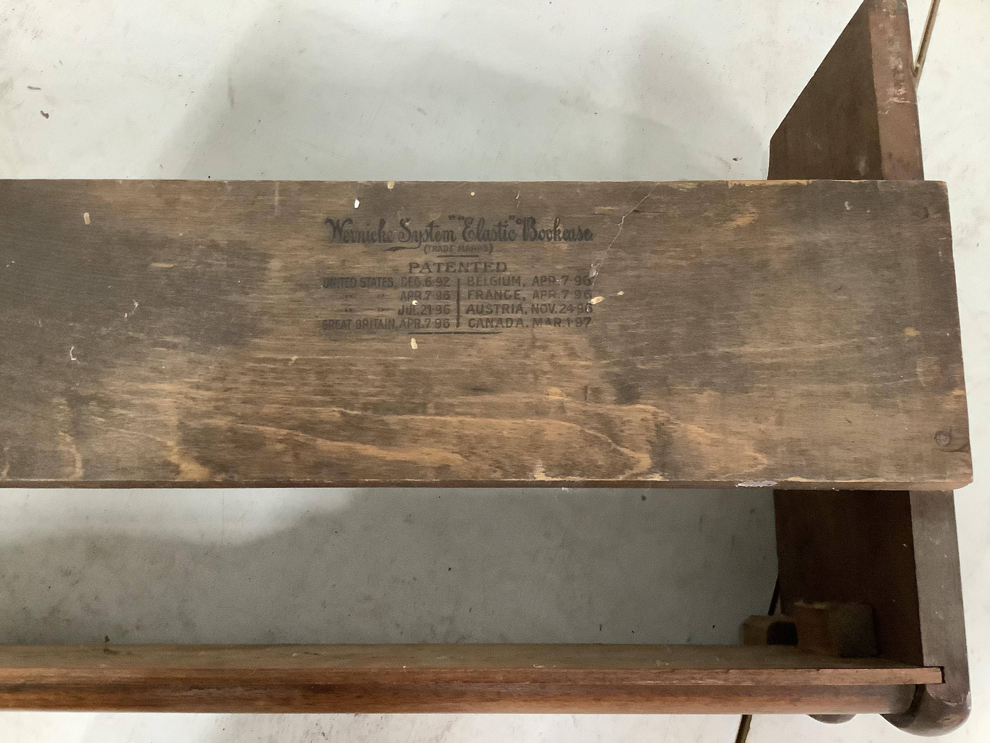 A walnut Globe Wernicke style four section bookcase, width 86cm, depth 29cm, height 160cm